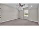 Neutral bedroom featuring carpet flooring, ceiling fan, recessed lights, and a window at 1385 Ewell Rd, Lakeland, FL 33811