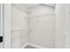 A walk-in closet features built-in white wire shelving for ample storage and organization at 1385 Ewell Rd, Lakeland, FL 33811