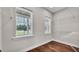 Spacious walk-in closet with windows and built-in shelving for organization at 1385 Ewell Rd, Lakeland, FL 33811