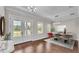 A dining room featuring hardwood floors, natural light, and french doors leading to the yard at 1385 Ewell Rd, Lakeland, FL 33811