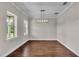 A dining room with hardwood floors and natural light at 1385 Ewell Rd, Lakeland, FL 33811