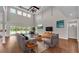 Elegant living room with vaulted ceilings, hardwood floors, and abundant natural light at 1385 Ewell Rd, Lakeland, FL 33811