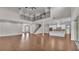 Open-concept living area with high ceilings, hardwood floors, and ample natural light at 1385 Ewell Rd, Lakeland, FL 33811