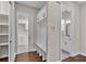 Mudroom with built-in storage, bench seating, and convenient access to the bathroom at 1385 Ewell Rd, Lakeland, FL 33811