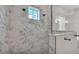 Elegant bathroom with marble tiled shower and a glass partition at 1385 Ewell Rd, Lakeland, FL 33811