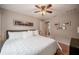 Bedroom with white walls, hardwood floors, ceiling fan, lots of natural light, and neutral tones at 1425 Hallam Dr, Lakeland, FL 33813