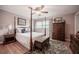 Primary bedroom with four-poster bed, hardwood floors, and matching bedside tables at 1425 Hallam Dr, Lakeland, FL 33813