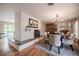 A formal dining room featuring hardwood floors and a brick accent wall with a fireplace at 1425 Hallam Dr, Lakeland, FL 33813