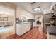 Functional kitchen featuring white cabinets, stainless steel appliances, and adjacent dining room at 1425 Hallam Dr, Lakeland, FL 33813
