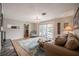 Comfortable living room with fireplace and view of pool through sliding glass doors at 1425 Hallam Dr, Lakeland, FL 33813