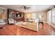 Spacious living room with custom built-ins, tile floors, and neutral color palette at 1425 Hallam Dr, Lakeland, FL 33813