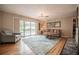 Bright living room with pool view through sliding glass doors and unique coffee table at 1425 Hallam Dr, Lakeland, FL 33813