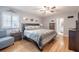 Serene main bedroom with hardwood floors, neutral paint and ensuite bathroom at 1425 Hallam Dr, Lakeland, FL 33813