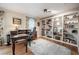 Bright home office featuring custom built-ins, wood floors and large window for plenty of natural light at 1425 Hallam Dr, Lakeland, FL 33813