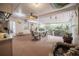 Outdoor kitchen and dining area with a built-in grill and scenic views of the backyard at 1425 Hallam Dr, Lakeland, FL 33813