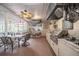 Enjoy the outdoor kitchen with a built-in grill, granite countertops, and a cozy seating area at 1425 Hallam Dr, Lakeland, FL 33813