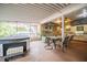 Enjoy outdoor dining with a covered patio, a full outdoor kitchen, and jacuzzi at 1425 Hallam Dr, Lakeland, FL 33813