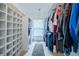 Organized walk-in closet with custom shelving and plenty of space for clothes and accessories at 1425 Hallam Dr, Lakeland, FL 33813