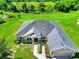 Stunning aerial view of home showcasing the roof, spacious lot, and verdant surroundings at 1531 Blue Sky Blvd, Haines City, FL 33844