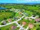The aerial shot showcases a suburban area with well-maintained homes, lush landscaping, and convenient neighborhood streets at 1531 Blue Sky Blvd, Haines City, FL 33844