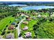 A suburban neighborhood showcases the property's lush surroundings, mature trees, and its proximity to nearby lakes at 1531 Blue Sky Blvd, Haines City, FL 33844