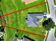 This aerial shot highlights the property's large lot with well-maintained landscaping and a paved driveway at 1531 Blue Sky Blvd, Haines City, FL 33844