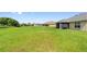 Expansive backyard offers ample space for outdoor activities, with a well-maintained lawn at 1531 Blue Sky Blvd, Haines City, FL 33844