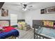 Cozy ' bedroom with a comfortable chair and a neutral two-tone paint scheme at 1531 Blue Sky Blvd, Haines City, FL 33844