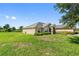 Well maintained home exterior with landscaped yard and neutral color palette creating curb appeal at 1531 Blue Sky Blvd, Haines City, FL 33844