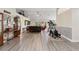 Open living space with new flooring, vaulted ceilings, and ample natural light at 1531 Blue Sky Blvd, Haines City, FL 33844