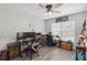 Home office featuring plank flooring, plenty of natural light, and space for two work areas at 1531 Blue Sky Blvd, Haines City, FL 33844