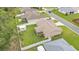 Overhead view of a home featuring a fenced backyard and shed, situated in a residential neighborhood at 1746 Grey Fox Dr, Lakeland, FL 33810