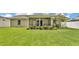 Lush backyard and covered patio at 1746 Grey Fox Dr, Lakeland, FL 33810