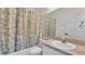 Cozy bathroom featuring a bathtub, shower, and single sink at 1746 Grey Fox Dr, Lakeland, FL 33810