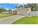 Charming one-story home showcasing a two-car garage and nicely maintained landscaping at 1746 Grey Fox Dr, Lakeland, FL 33810