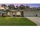 Charming home with well-manicured lawn and landscaping at 1746 Grey Fox Dr, Lakeland, FL 33810