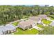 Beautiful home exterior with a lush lawn, fenced yard with shed, and long driveway at 1746 Grey Fox Dr, Lakeland, FL 33810