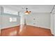 Bright and airy living area boasting hardwood floors and a ceiling fan at 1746 Grey Fox Dr, Lakeland, FL 33810
