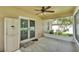 A view of the screened patio with a ceiling fan and access to the backyard at 1746 Grey Fox Dr, Lakeland, FL 33810