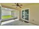 Screened patio with ceiling fan and view of fenced backyard at 1746 Grey Fox Dr, Lakeland, FL 33810