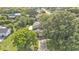Aerial view showcasing a well-maintained home with mature trees and landscaping at 1910 Clubhouse Rd, Lakeland, FL 33813