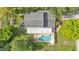 A birds-eye view showcases a well-maintained pool and outdoor seating area at 1910 Clubhouse Rd, Lakeland, FL 33813