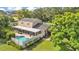 Aerial view of home featuring a pool, screened-in patio, and fenced yard at 1910 Clubhouse Rd, Lakeland, FL 33813