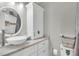 Bright bathroom with a vessel sink, marble countertop, and decorative accents at 1910 Clubhouse Rd, Lakeland, FL 33813