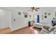 Spacious bedroom with hardwood floors, light-filled window, and cozy seating at 1910 Clubhouse Rd, Lakeland, FL 33813