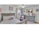 Charming bedroom with a ceiling fan and soft lighting, featuring a reading nook at 1910 Clubhouse Rd, Lakeland, FL 33813