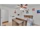 Stylish bedroom features a wooden crib with nautical-themed decor and ceiling fan at 1910 Clubhouse Rd, Lakeland, FL 33813