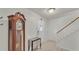 Inviting entryway with tiled floors, staircase, and a decorative grandfather clock at 1910 Clubhouse Rd, Lakeland, FL 33813