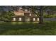 Charming two-story home with brick accents and a well-manicured front yard at 1910 Clubhouse Rd, Lakeland, FL 33813