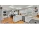 Open kitchen area with white cabinetry, counter space, and dining nook at 1910 Clubhouse Rd, Lakeland, FL 33813